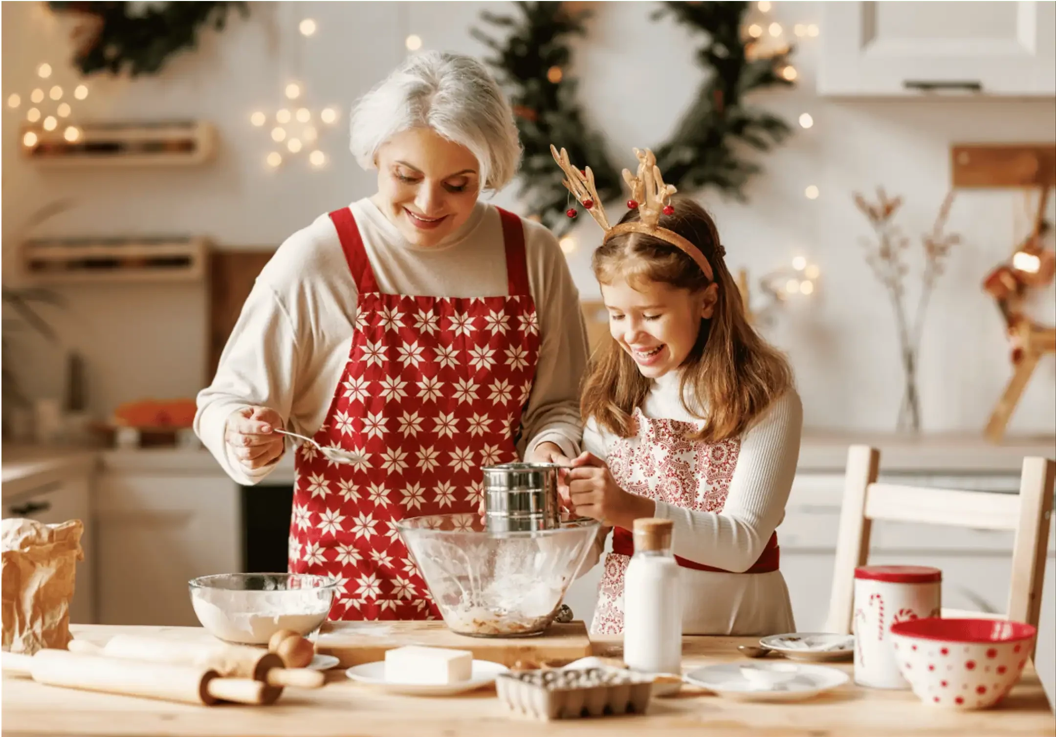 nanny and child baking holiday cookies